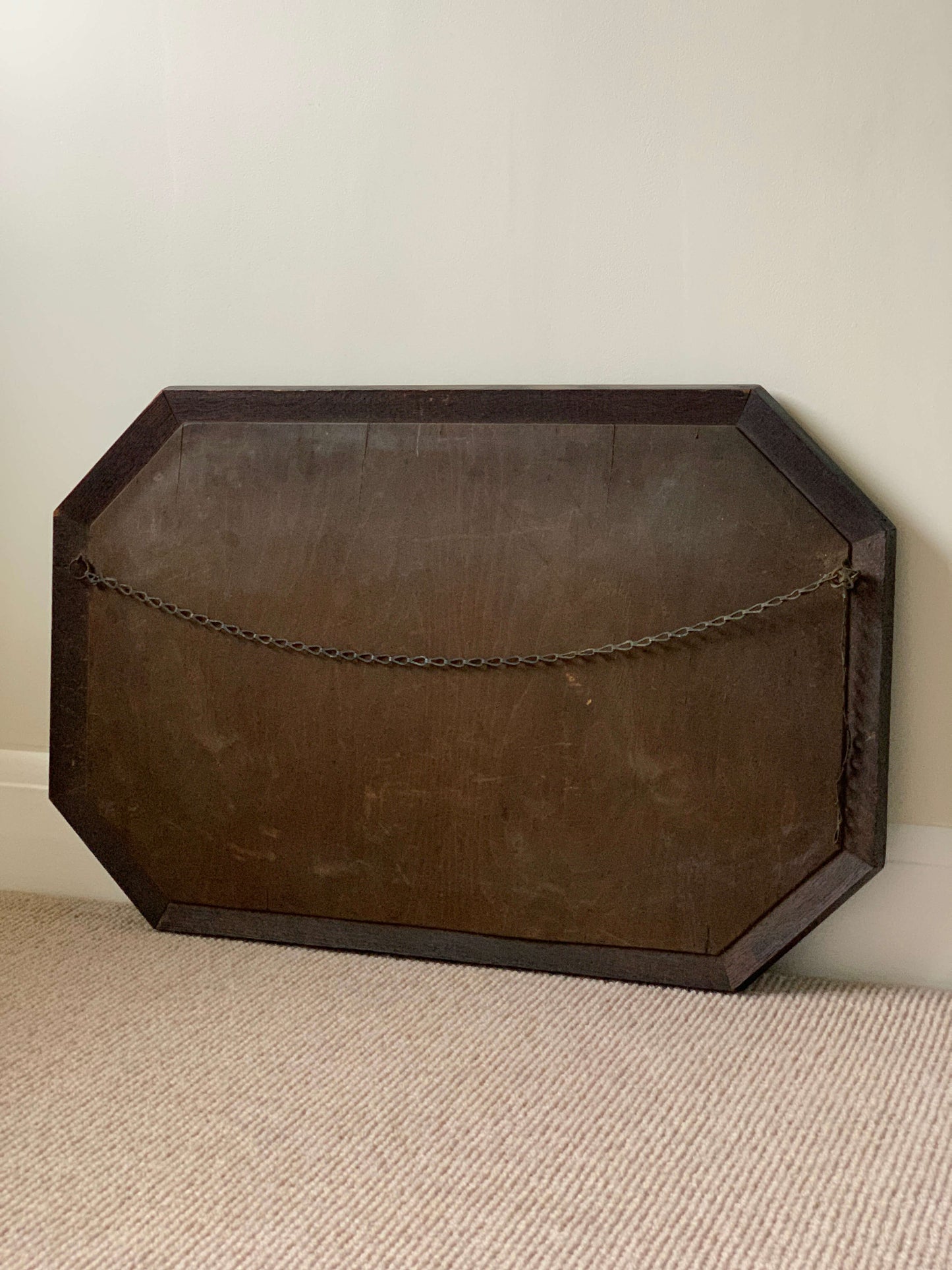 Antique octagonal mirror with aztec detail