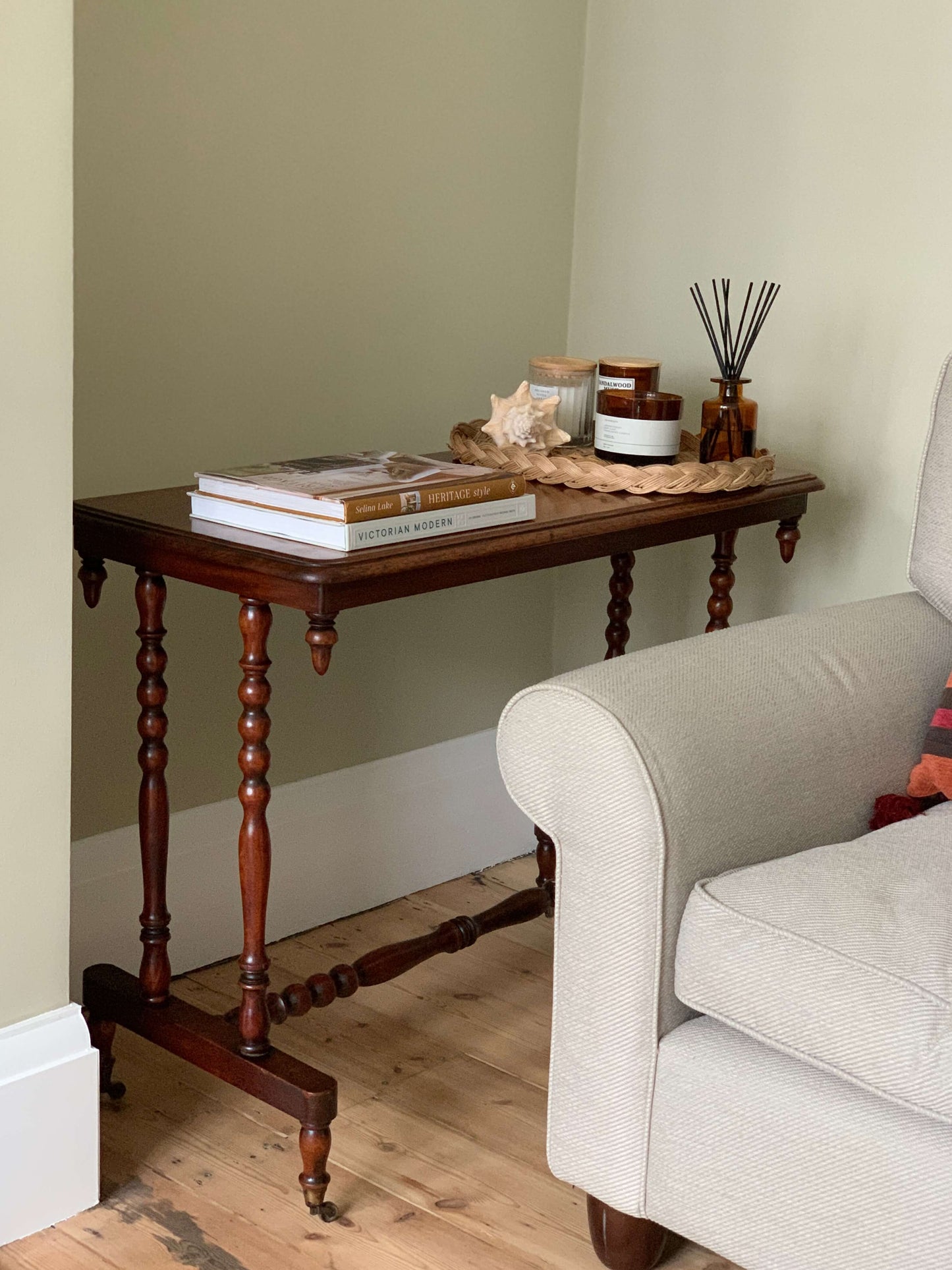 Antique bobbin console table on casters