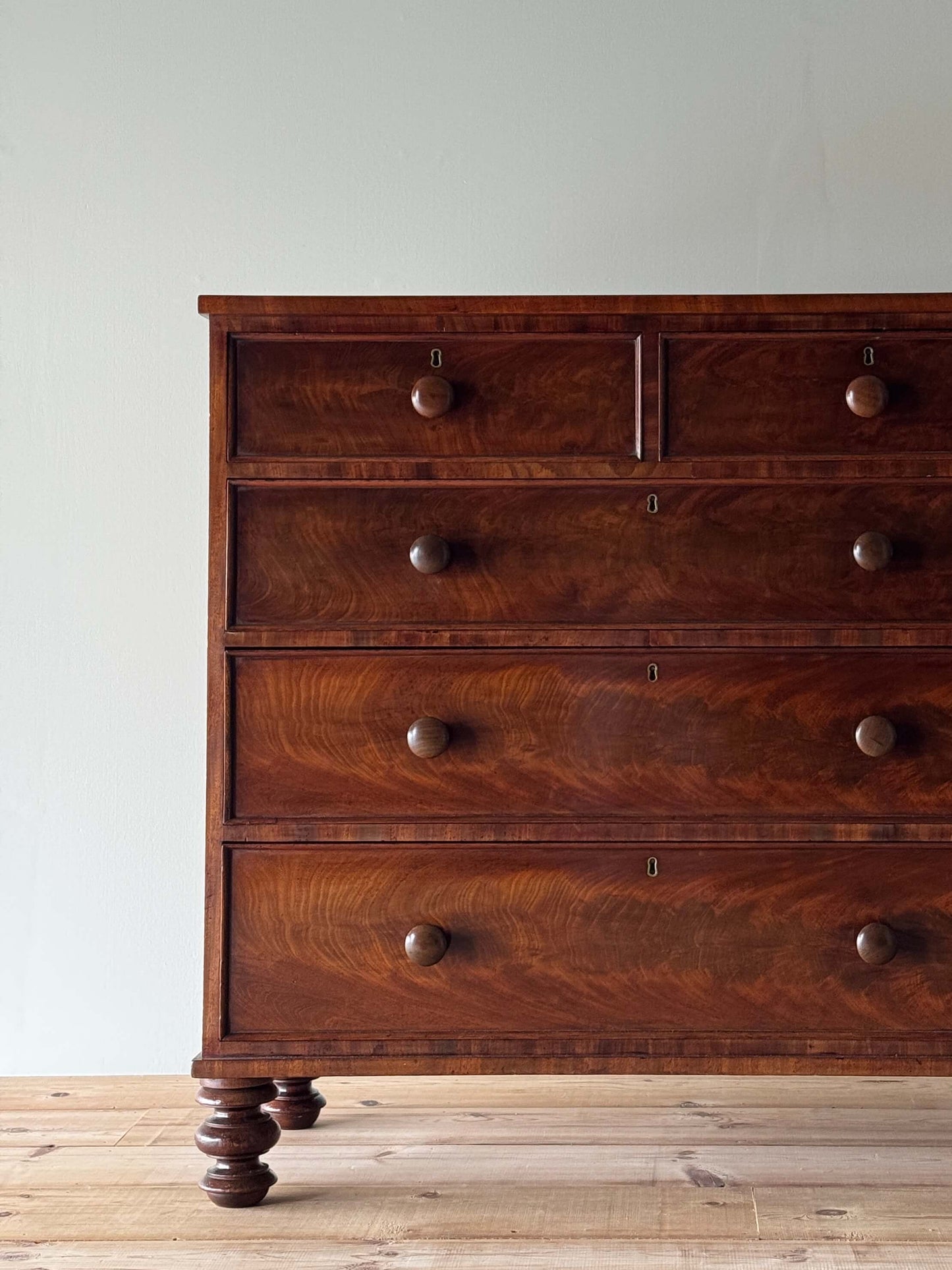 Victorian mahogany chest of drawers raised on turned feet