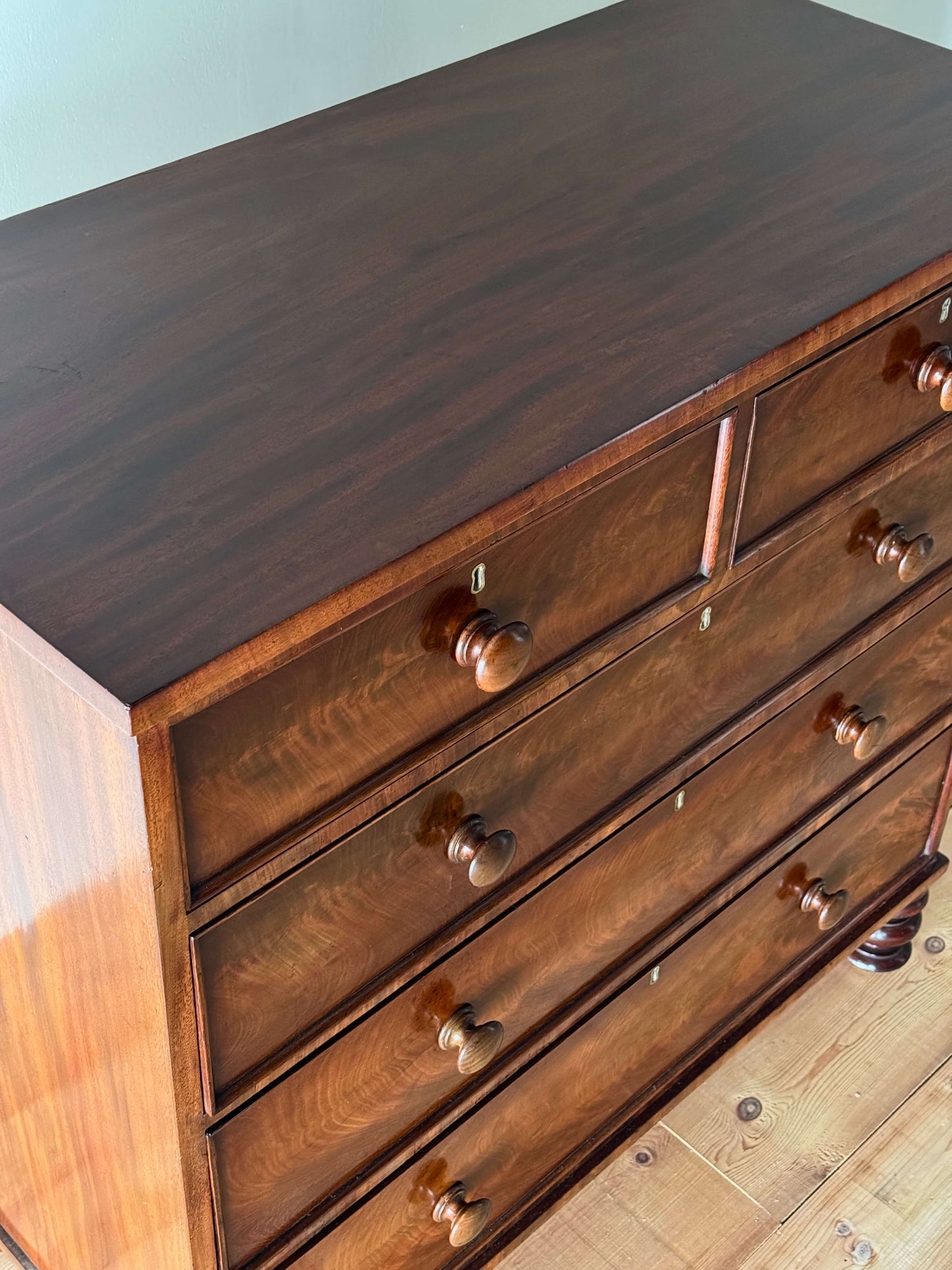 Victorian mahogany chest of drawers raised on turned feet