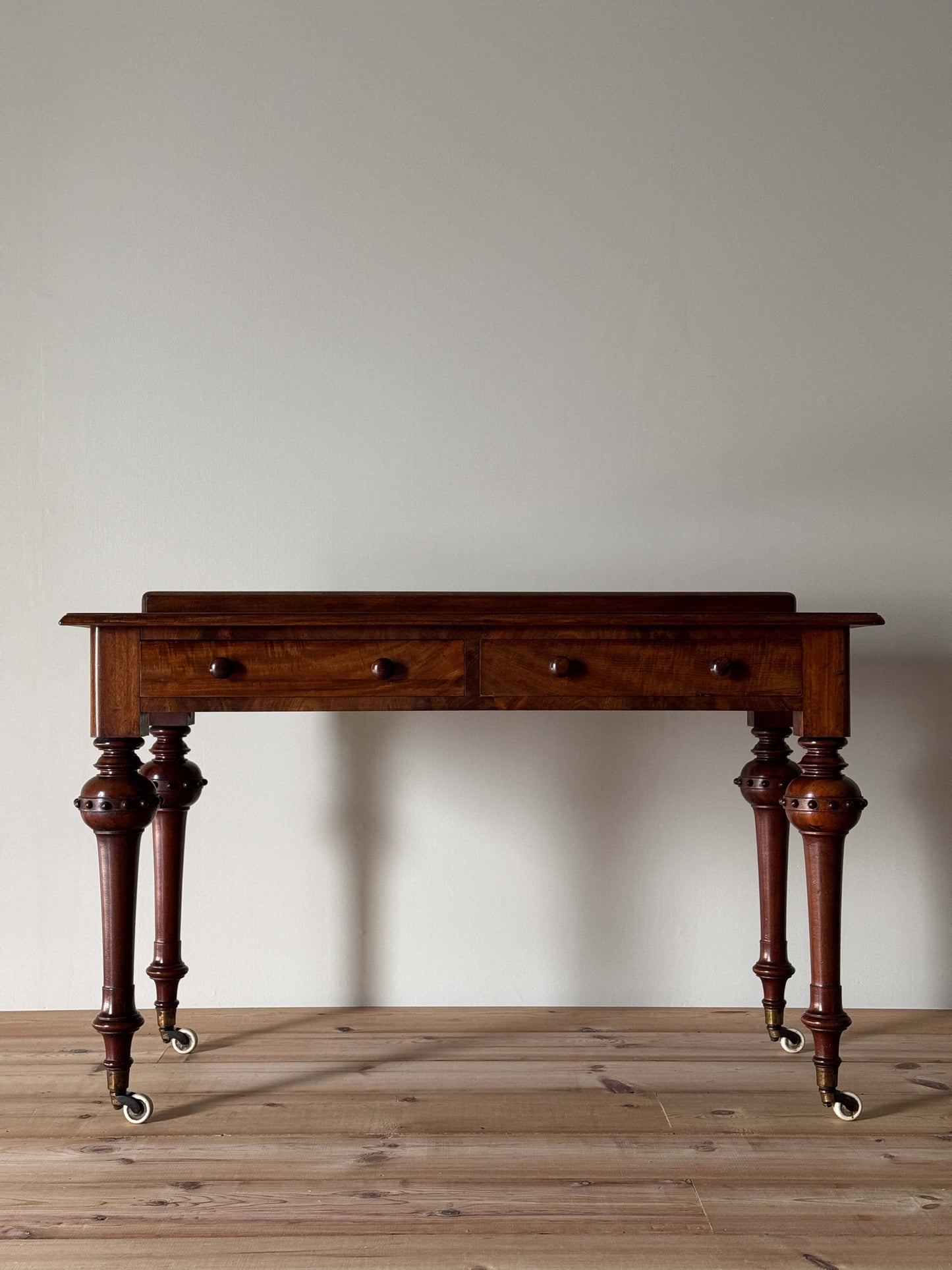 Victorian mahogany desk on casters