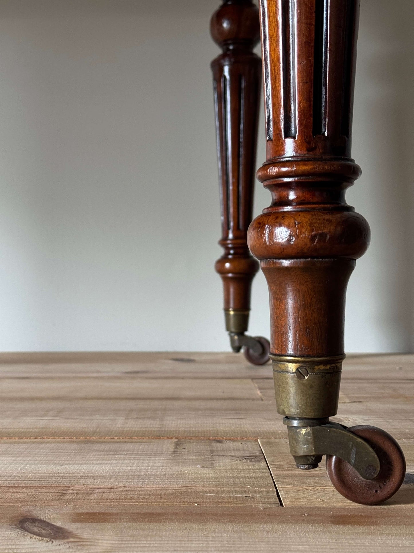 Victorian mahogany dining table on casters