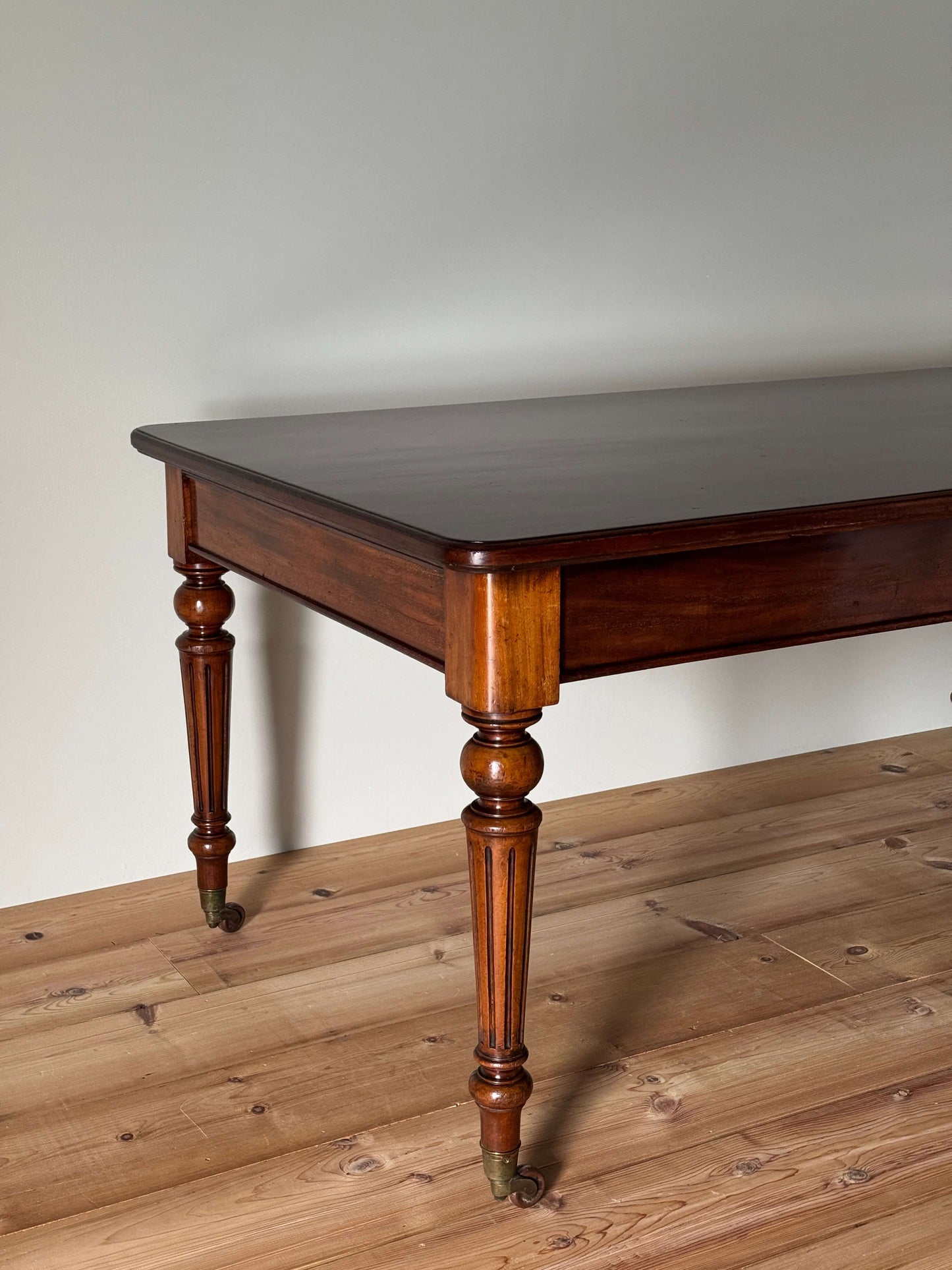 Victorian mahogany dining table on casters