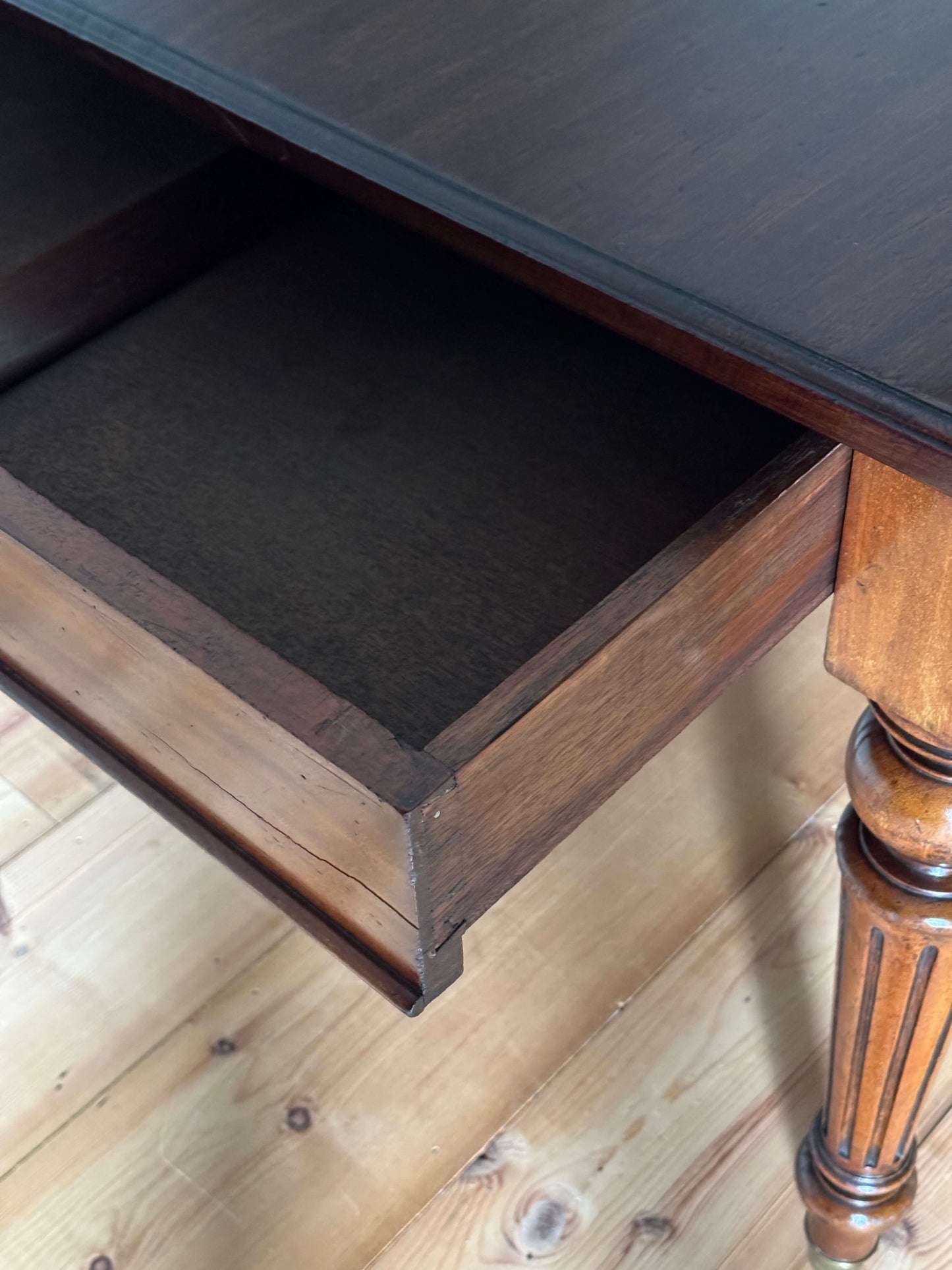 Victorian mahogany dining table on casters