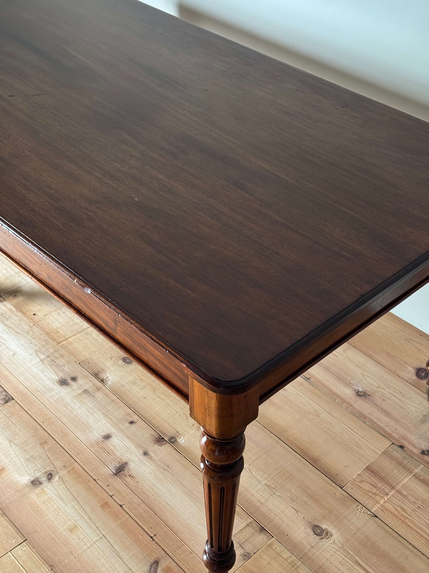 Victorian mahogany dining table on casters
