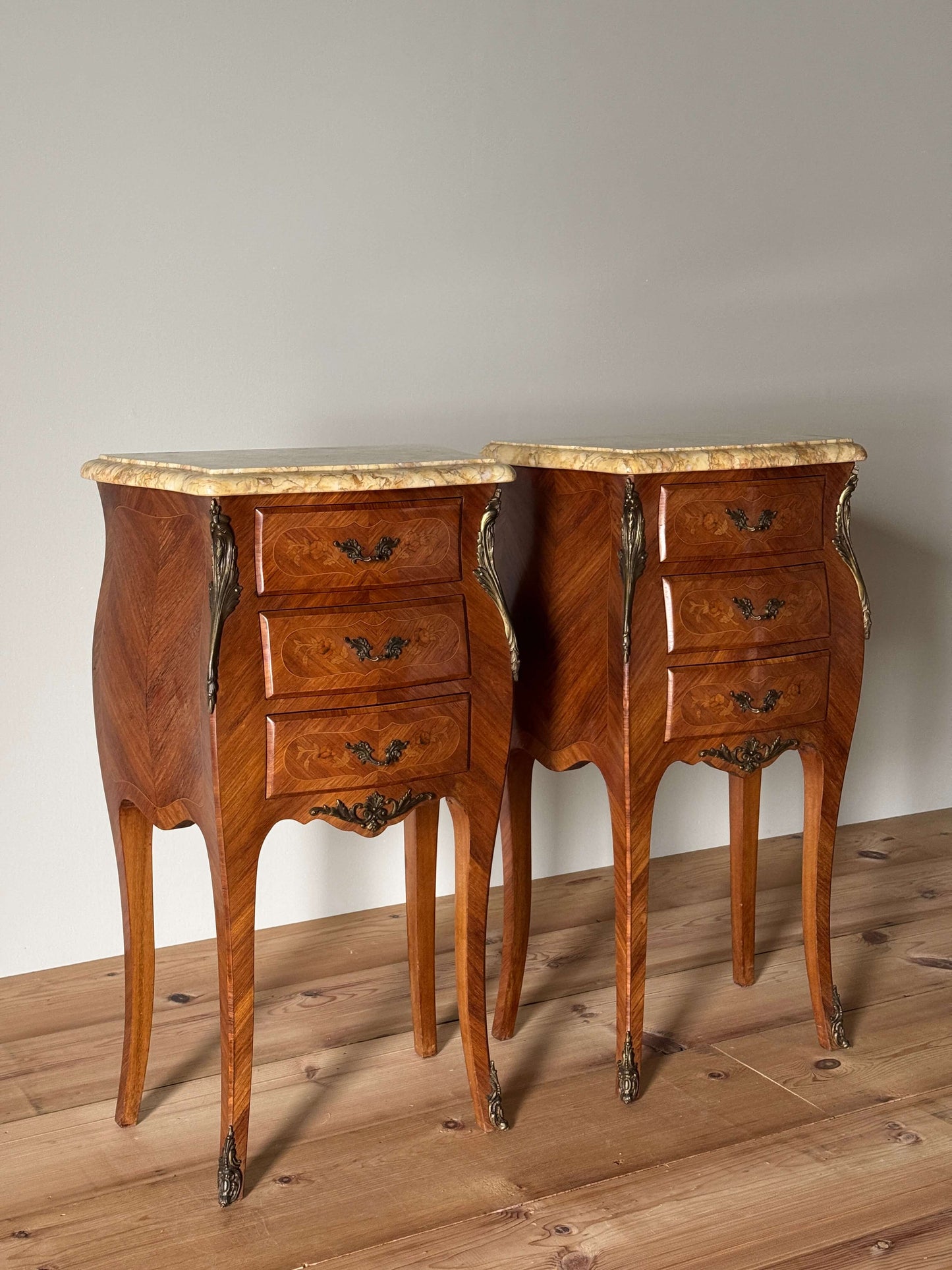 Pair of French antique marquetry bedside tables with marble tops