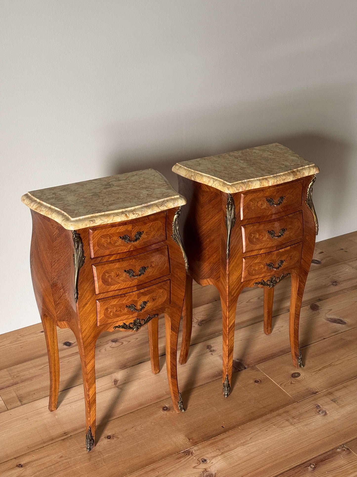Pair of French antique marquetry bedside tables with marble tops
