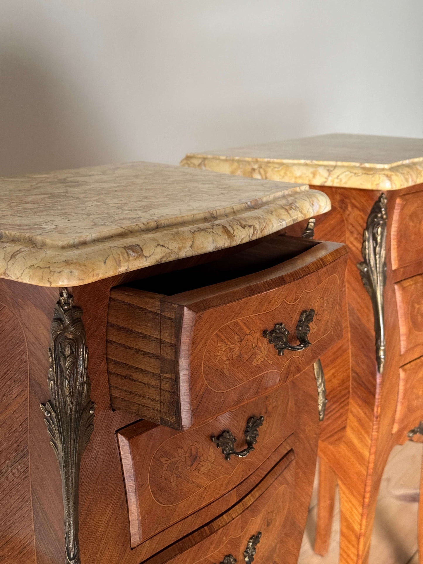 Pair of French antique marquetry bedside tables with marble tops