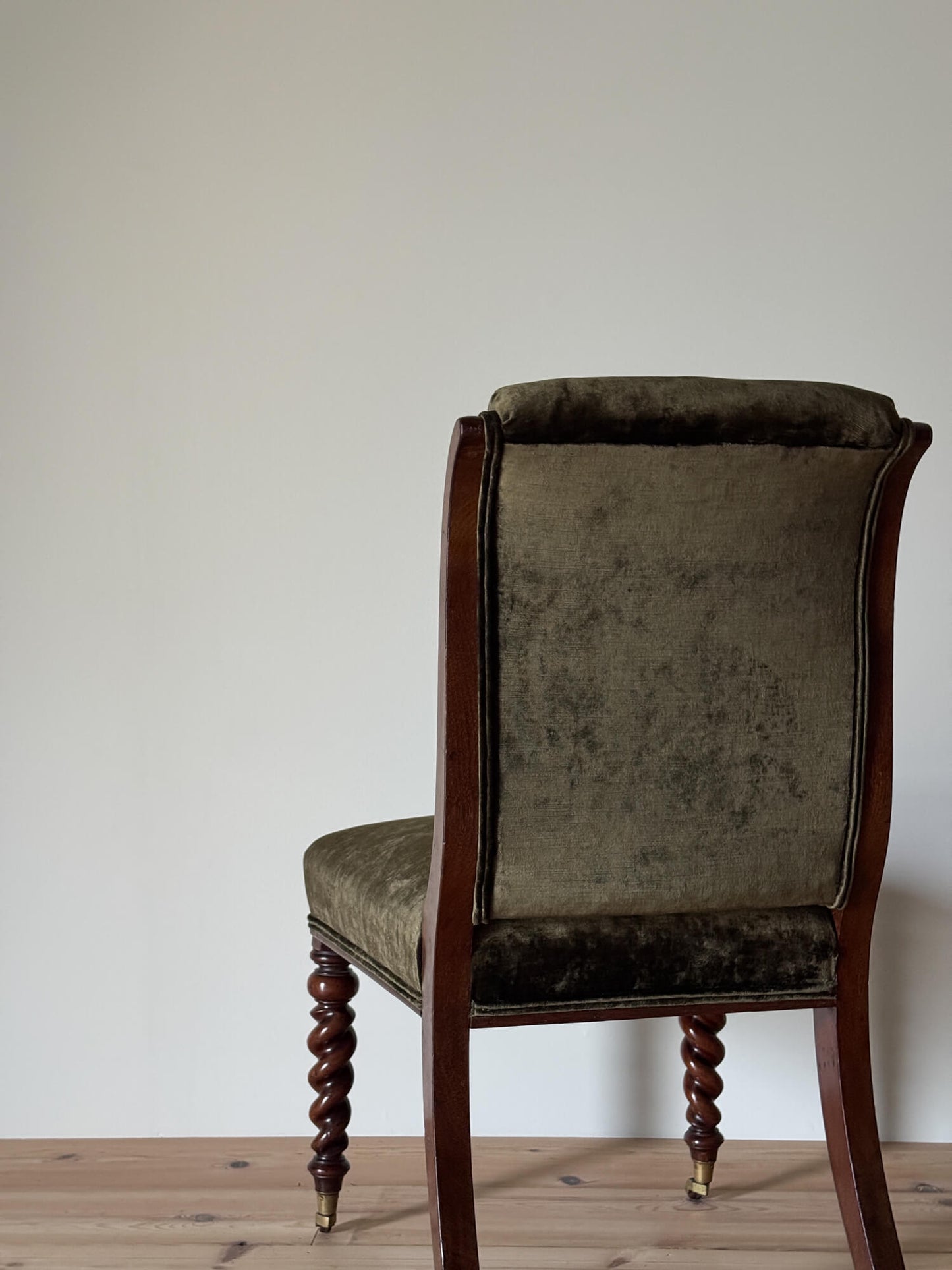 Antique occasional chair raised on barley twist legs