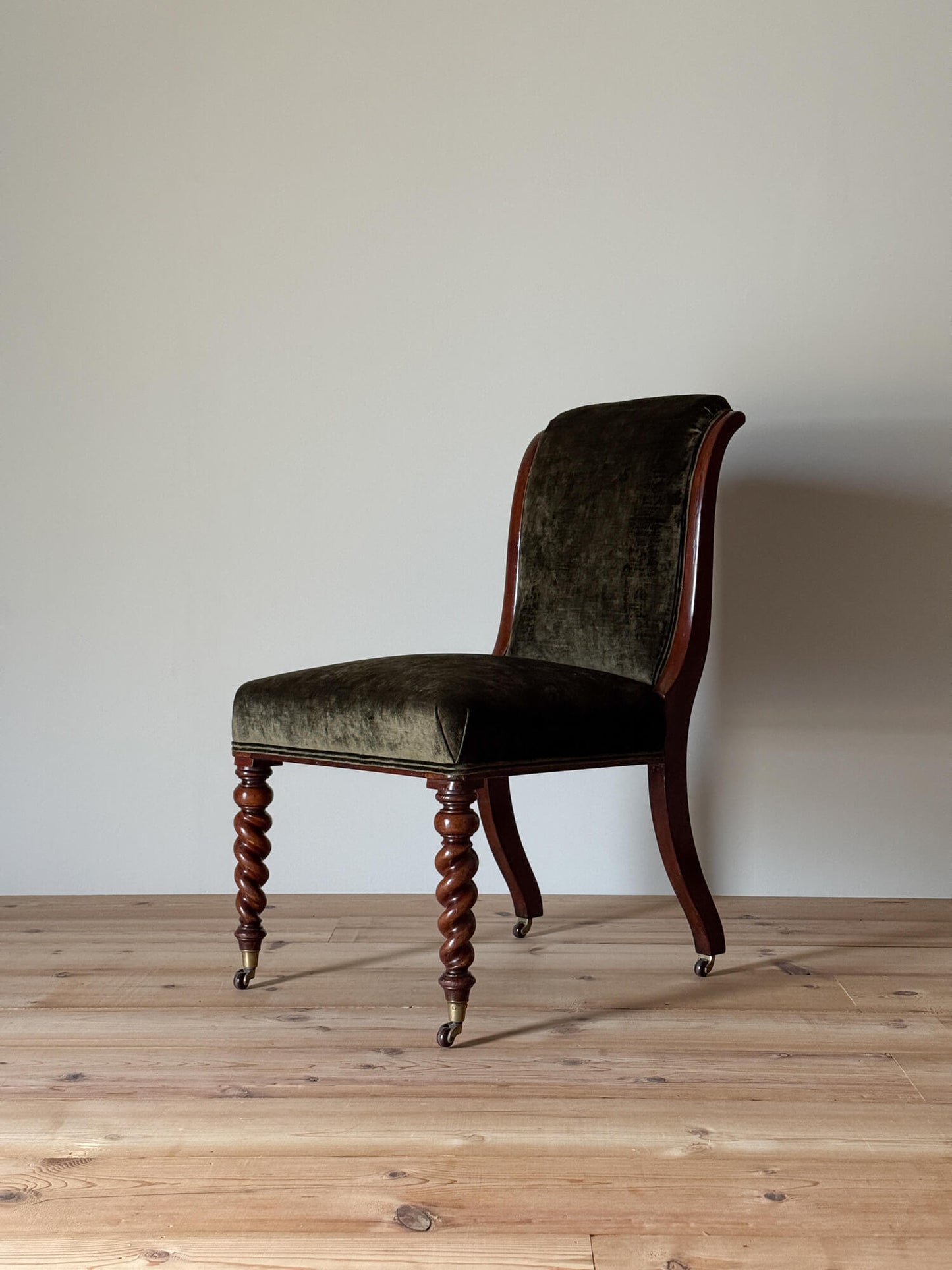 Antique occasional chair raised on barley twist legs