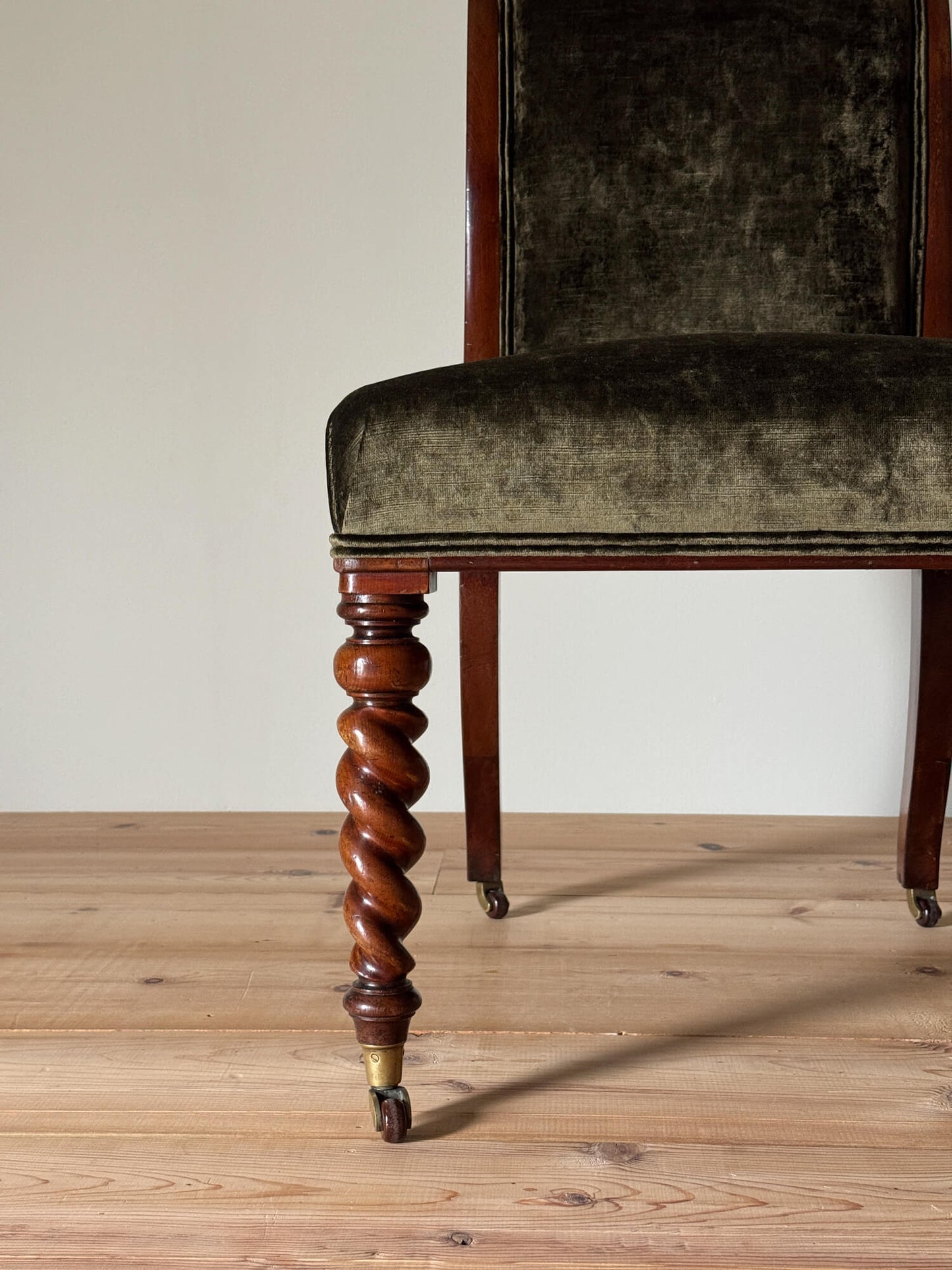 Antique occasional chair raised on barley twist legs