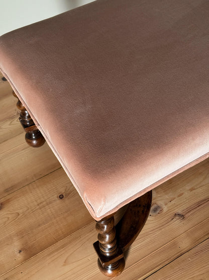 Antique footstool raised on barley twist supports