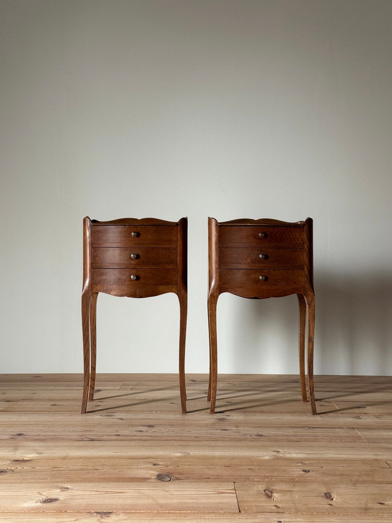 Pair of French vintage bedside tables with three drawers