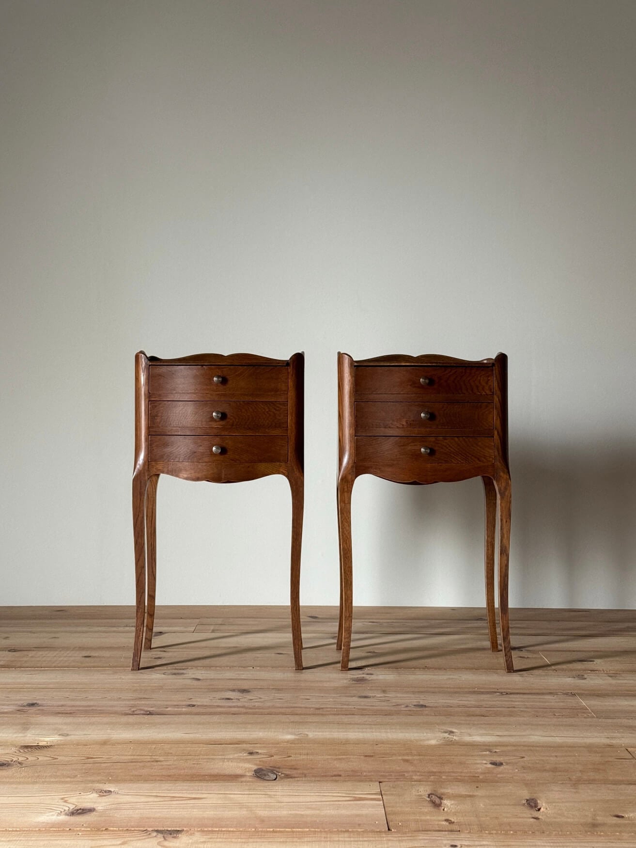 Pair of French vintage bedside tables with three drawers