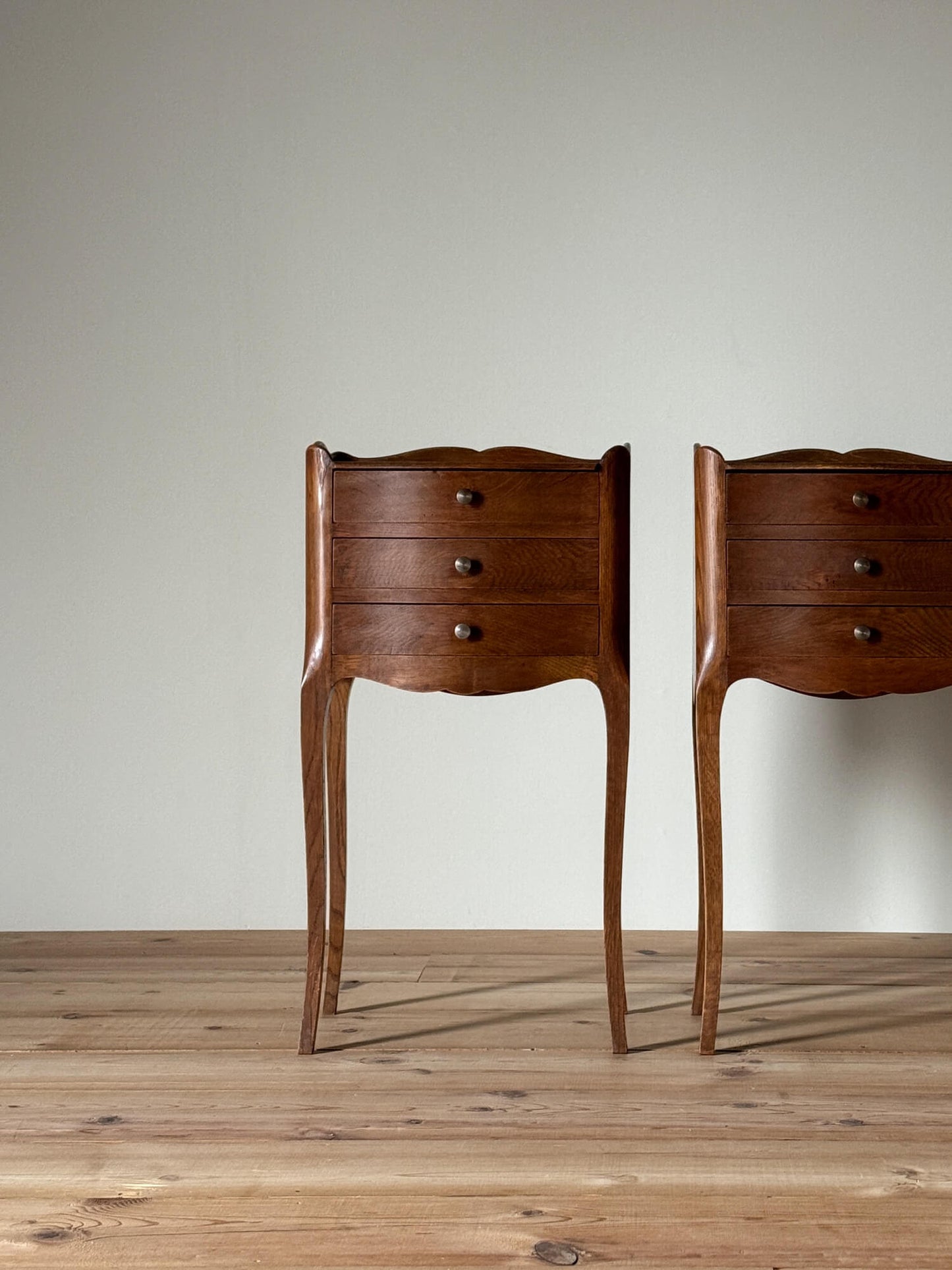 Pair of French vintage bedside tables with three drawers
