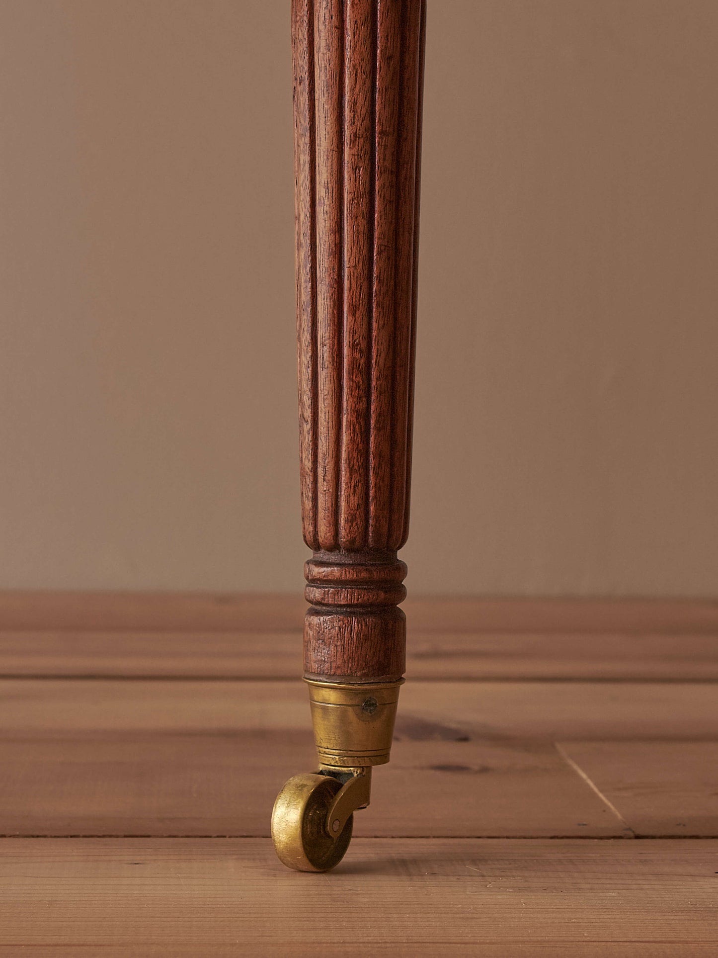 Pair of antique bergère chairs raised on brass castors