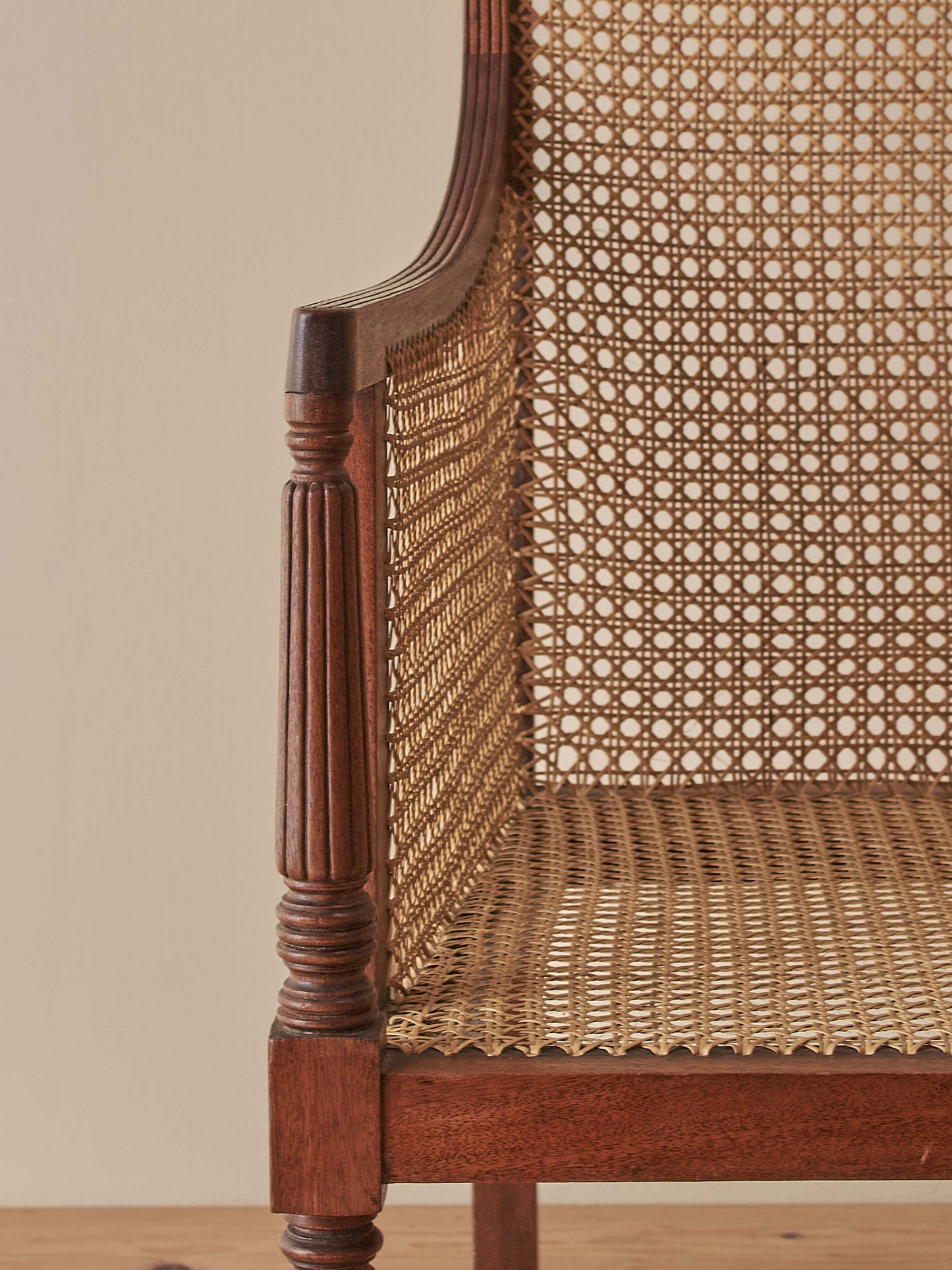 Pair of antique bergère chairs raised on brass castors