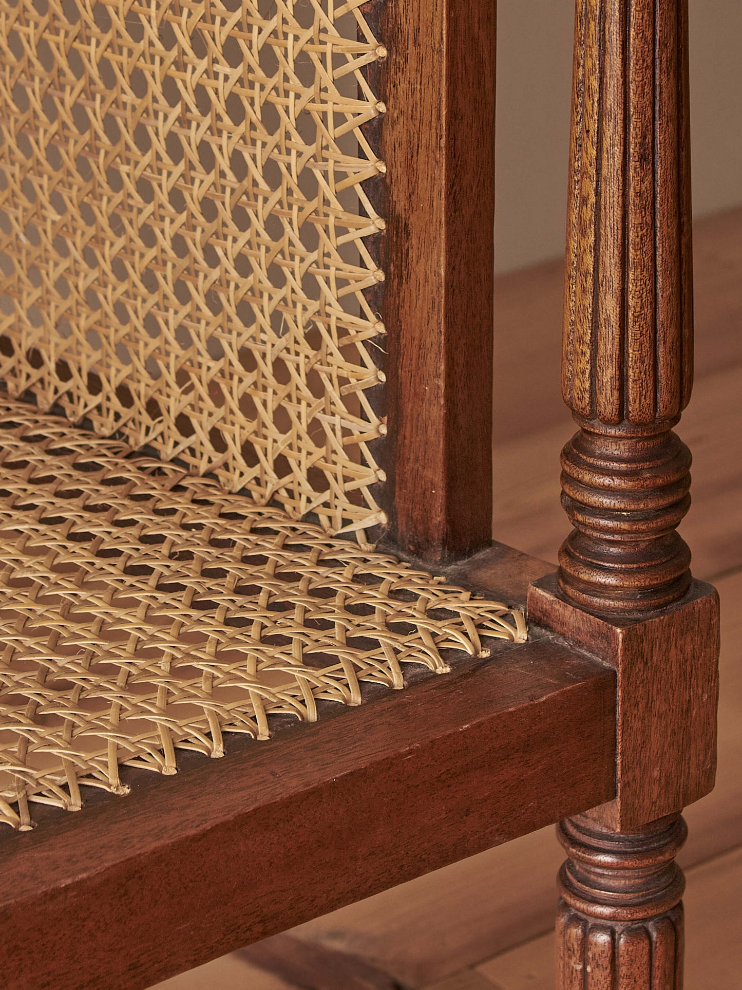 Pair of antique bergère chairs raised on brass castors