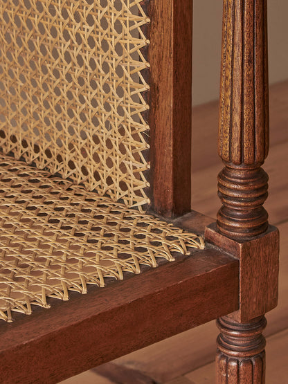 Pair of antique bergère chairs raised on brass castors