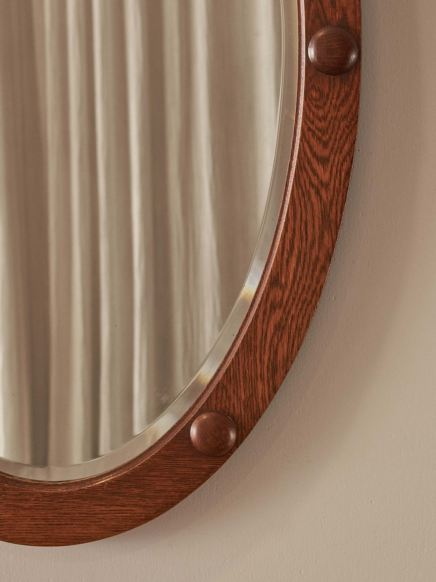 Antique oak oval mirror with circular details