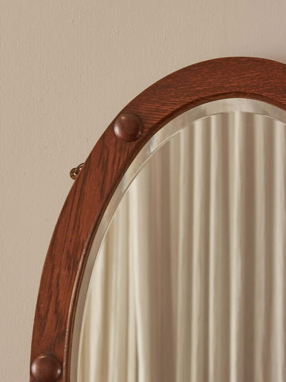 Antique oak oval mirror with circular details