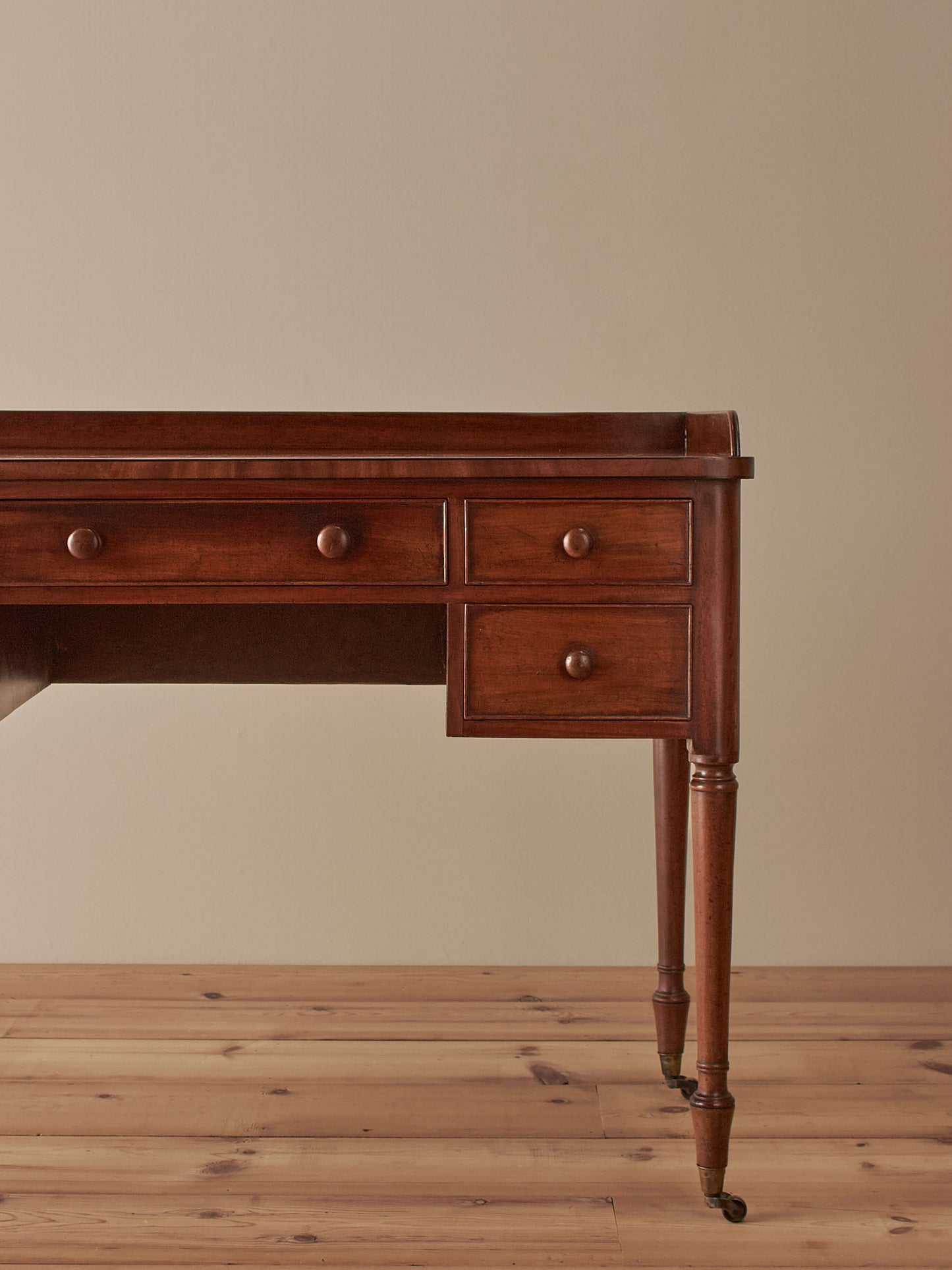 Antique Victorian mahogany writing desk on castors