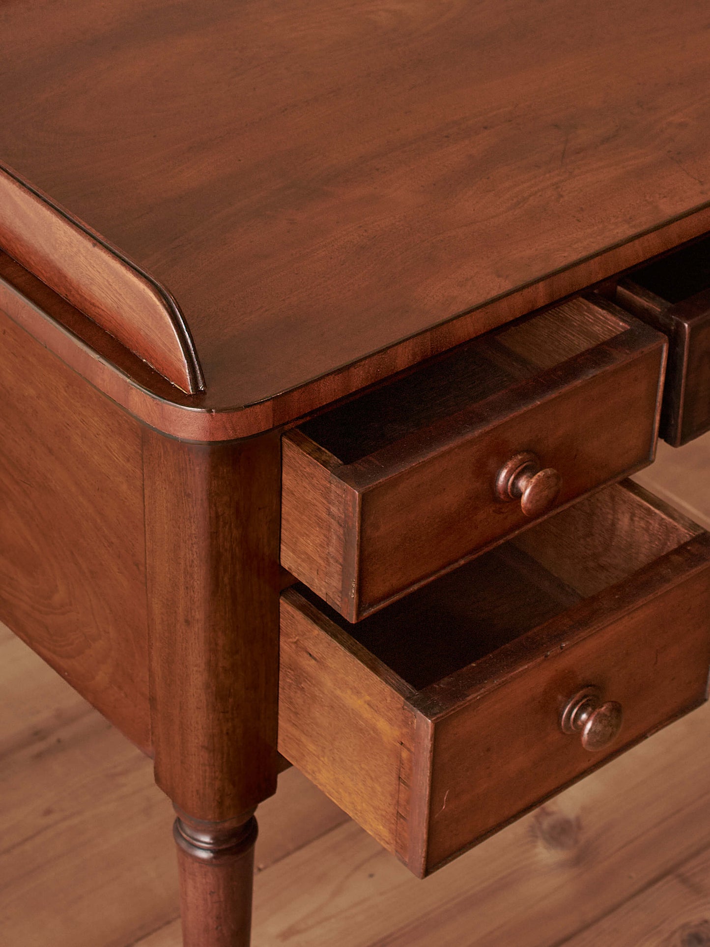 Antique Victorian mahogany writing desk on castors