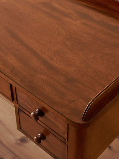 Antique Victorian mahogany writing desk on castors