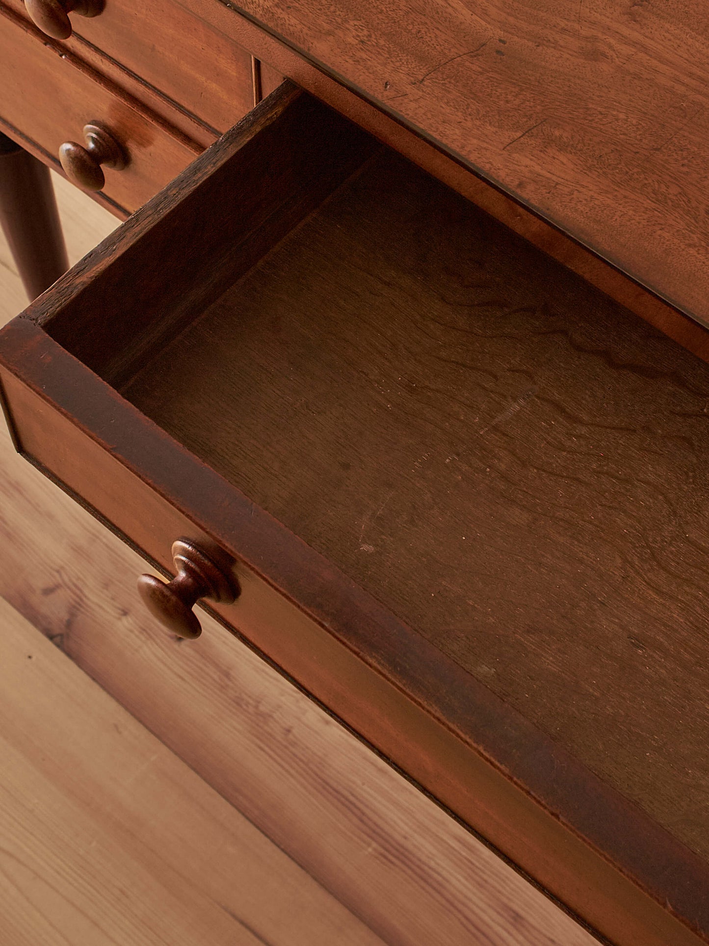 Antique Victorian mahogany writing desk on castors