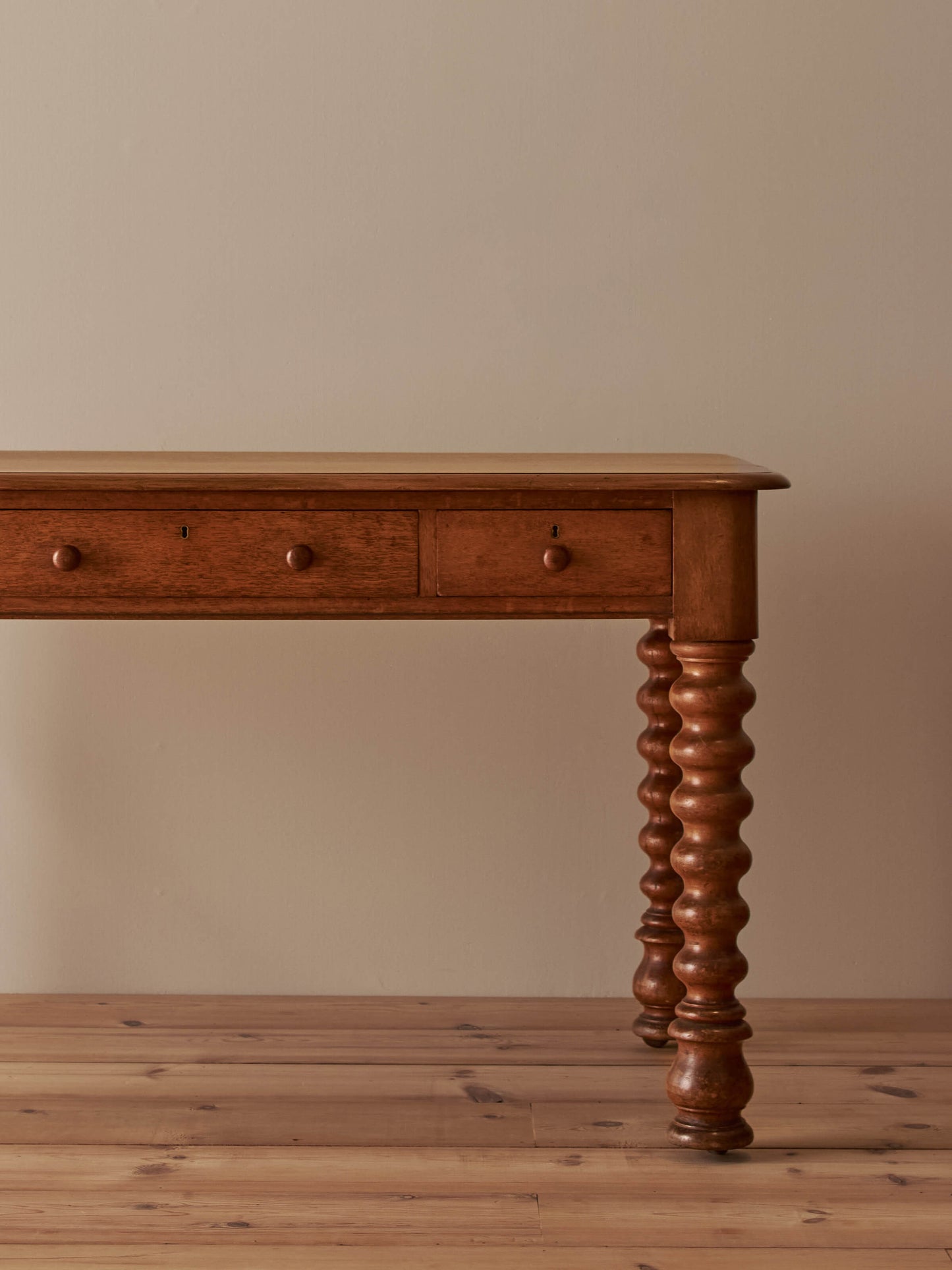 Victorian oak bobbin desk on castors