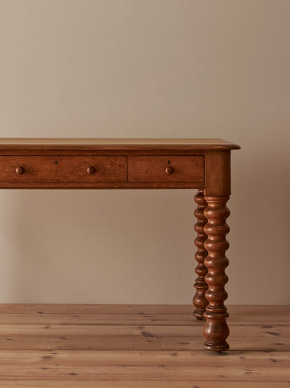 Victorian oak bobbin desk on castors