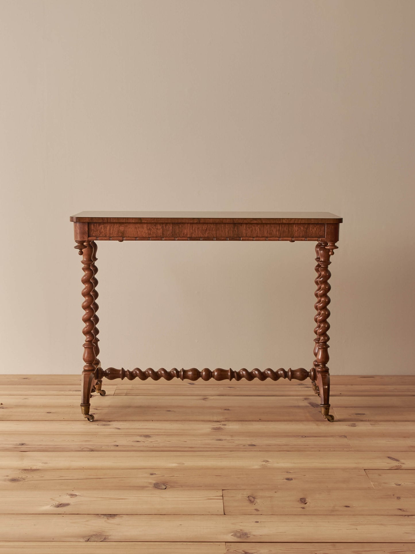 Victorian rosewood console table on brass castors