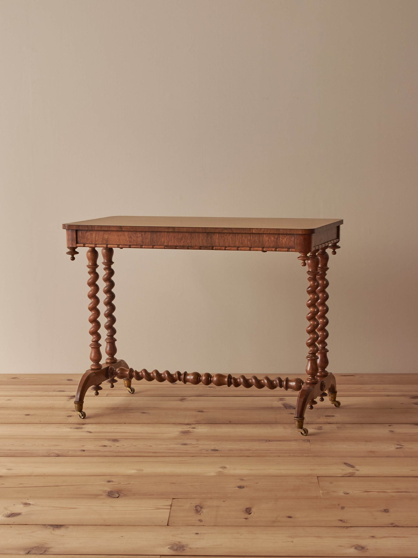Victorian rosewood console table on brass castors