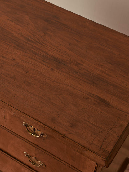 Georgian walnut chest of drawers raised on bracket feet