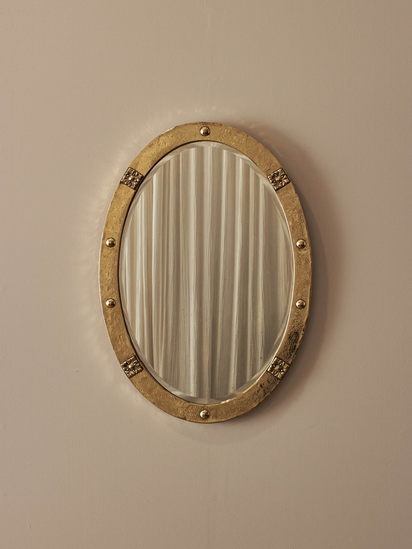 Arts and Crafts oval hammered brass mirror
