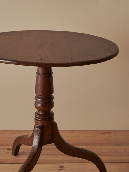 Antique circular oak tilt-top table