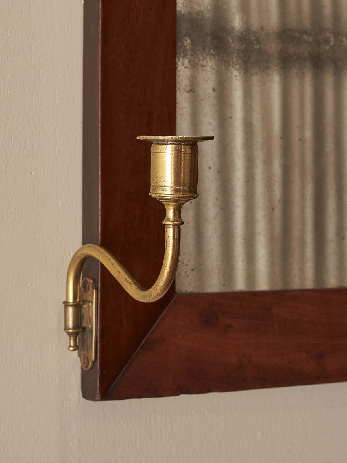 ON HOLD Antique walnut mirror flanked with brass candle sconces
