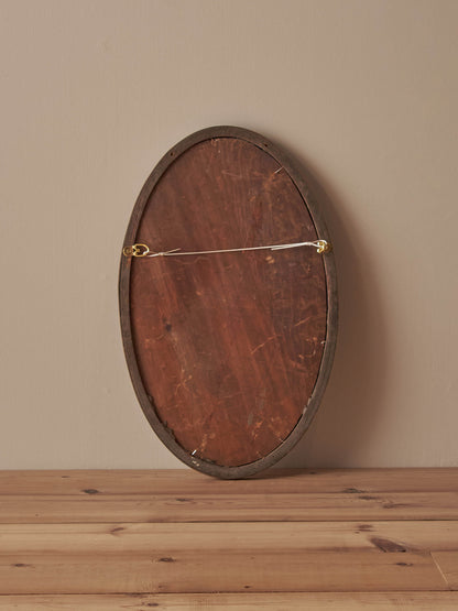Antique oval walnut mirror