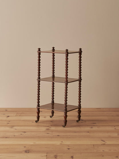 Victorian rosewood bobbin whatnot on castors