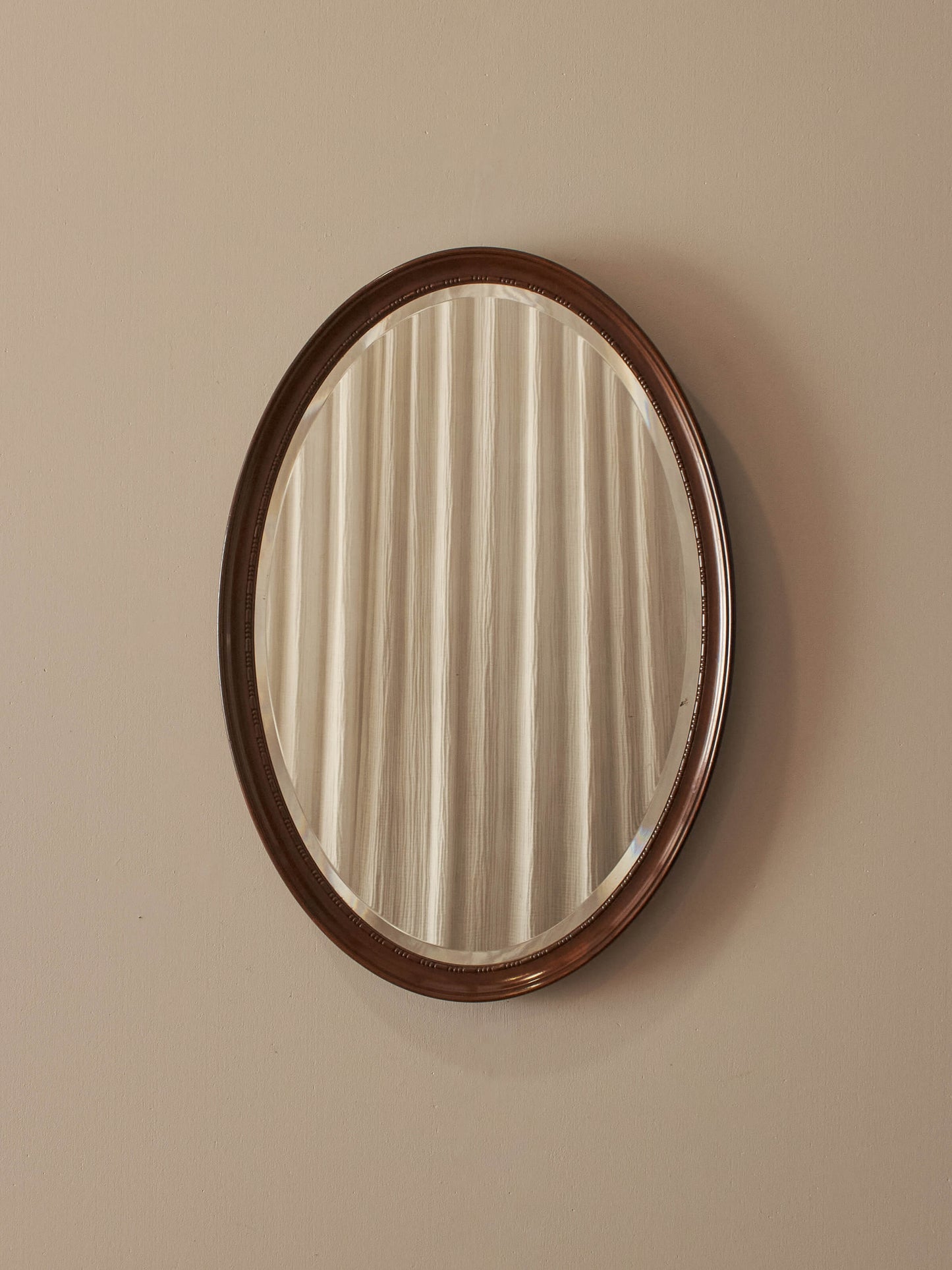 Edwardian oval mahogany mirror