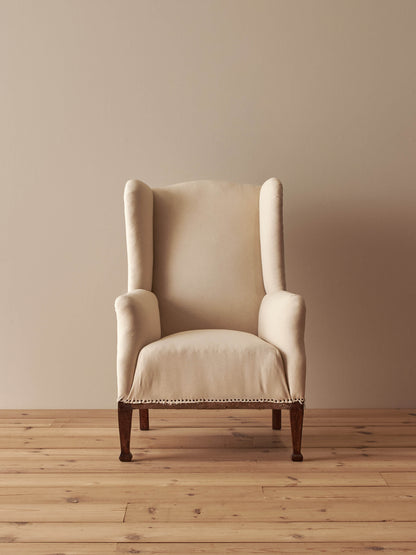 Edwardian upholstered wingback armchair