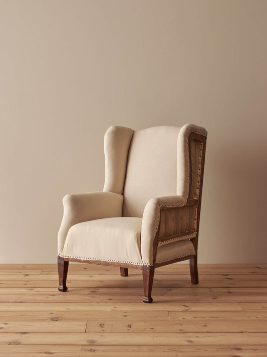 Edwardian upholstered wingback armchair