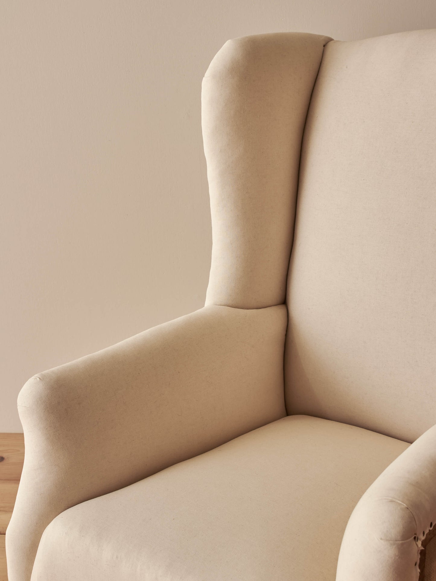 Edwardian upholstered wingback armchair