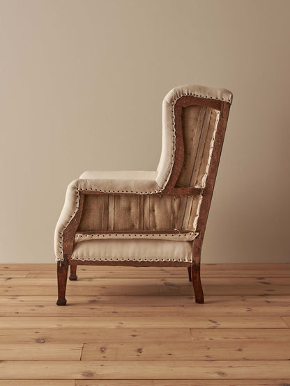 Edwardian upholstered wingback armchair