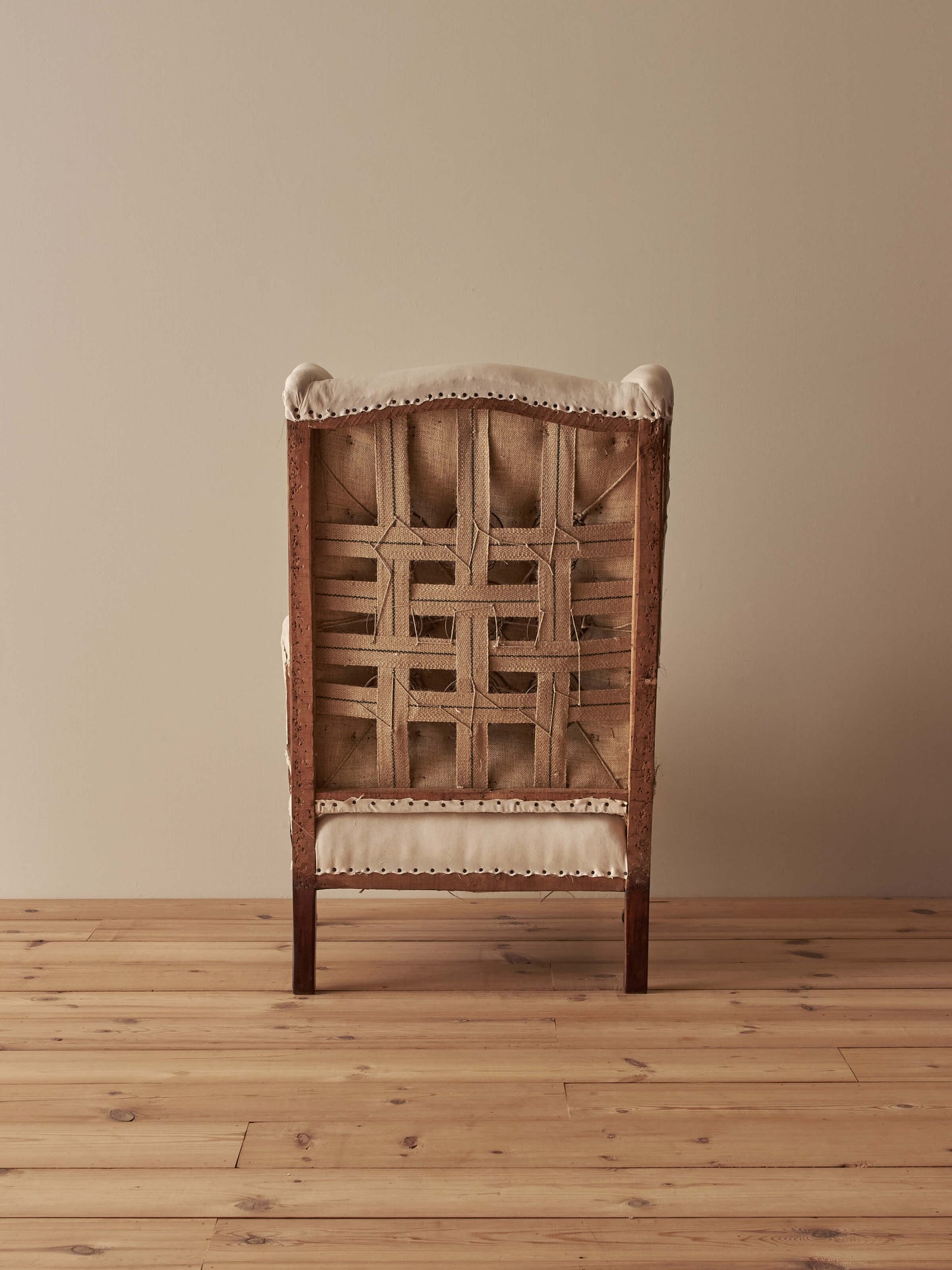 Edwardian upholstered wingback armchair