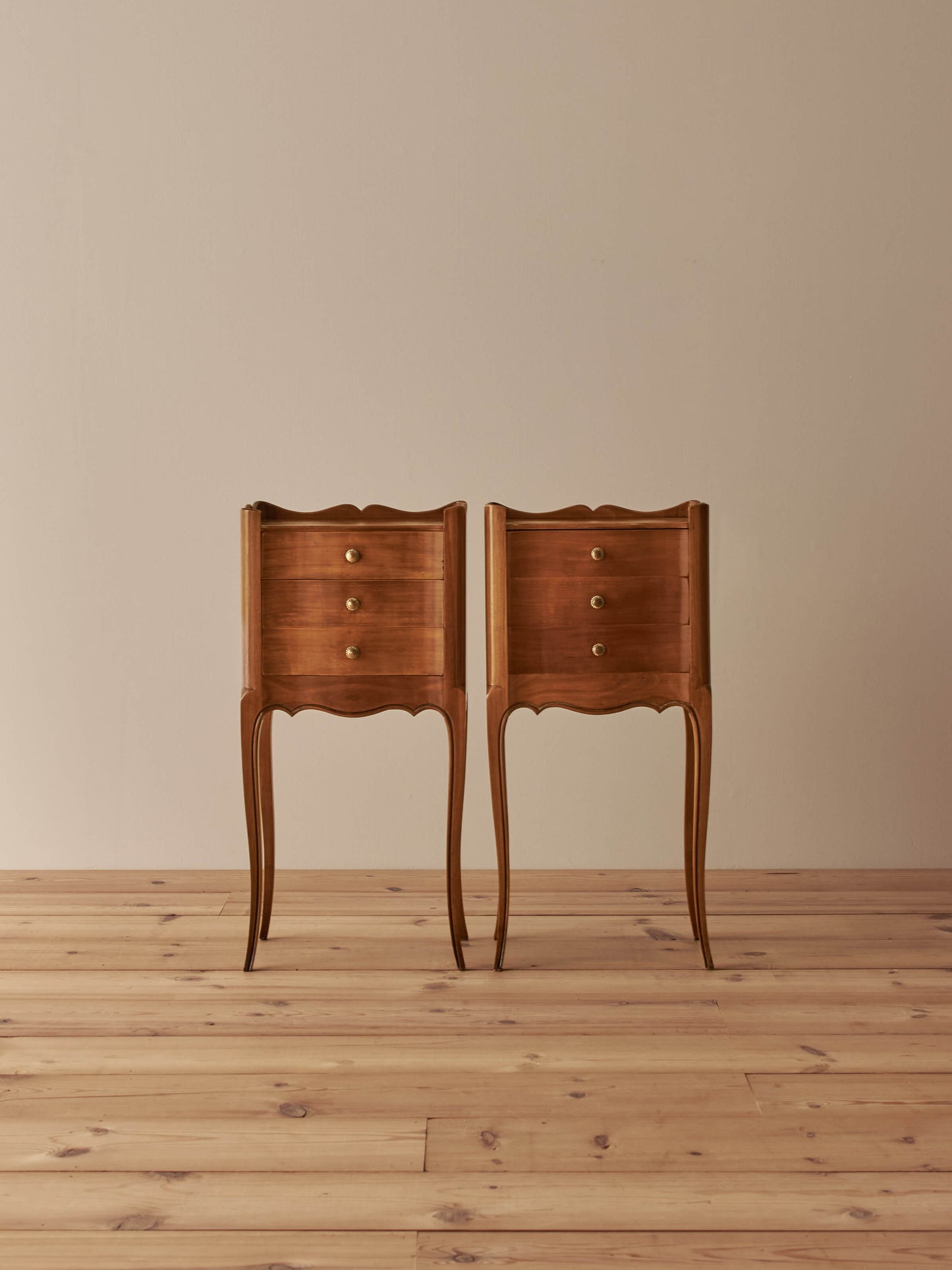 Pair of French cherry bedside tables with three drawers