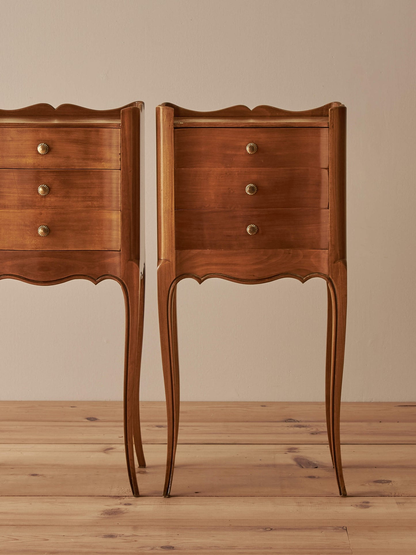 Pair of French cherry bedside tables with three drawers