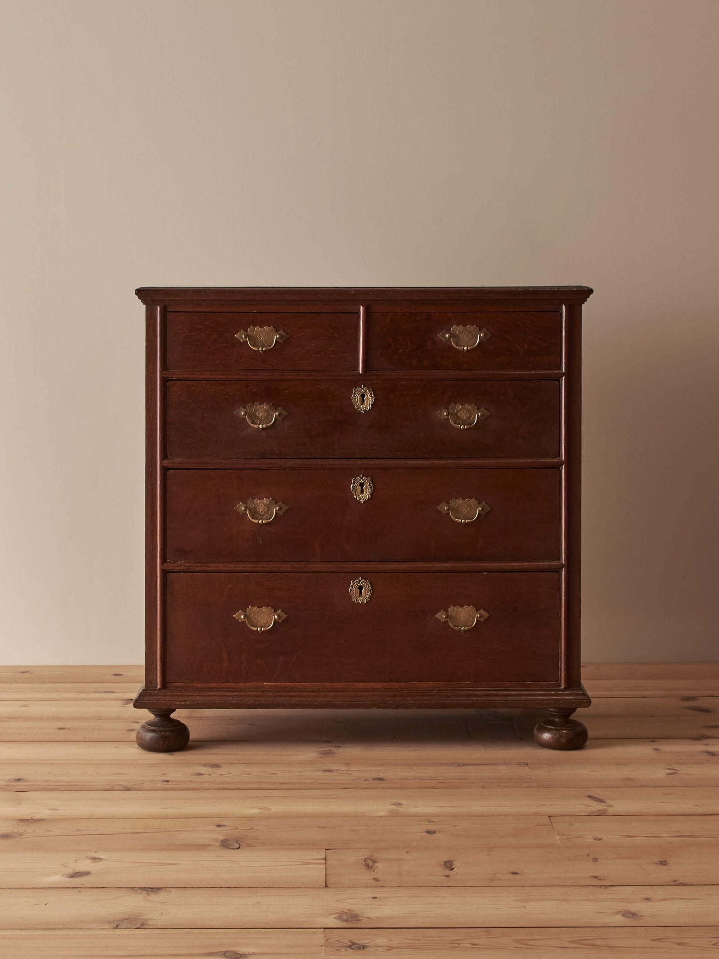 Georgian oak chest of drawers on bun feet