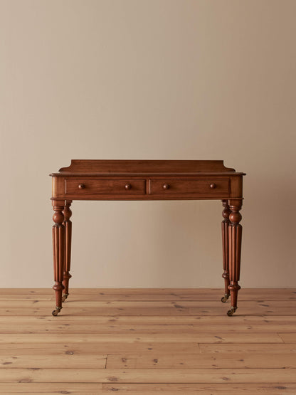 Victorian mahogany writing table with reeded legs