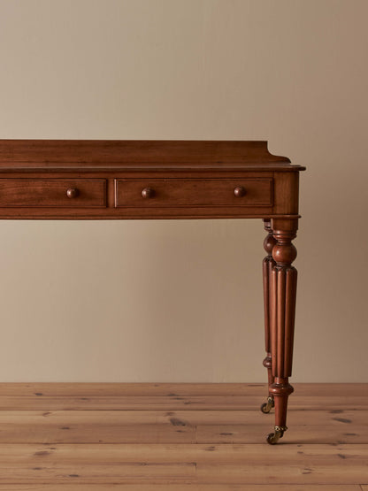 Victorian mahogany writing table with reeded legs